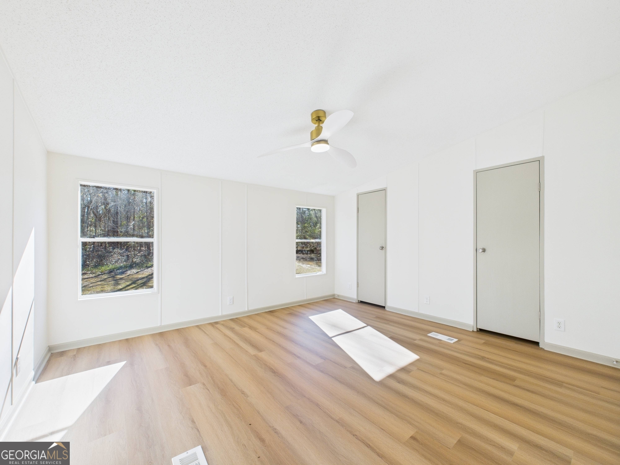 1669 Henderson Road Macon, GA 31217 - Photo 31 of 48 an empty room with wooden floor and windows