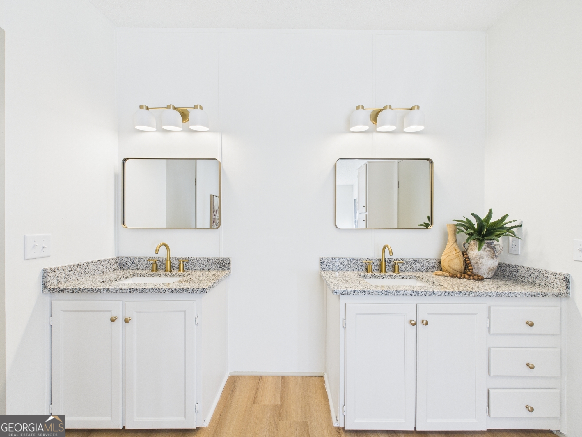 1669 Henderson Road Macon, GA 31217 - Photo 36 of 48 a bathroom with a sink and a mirror