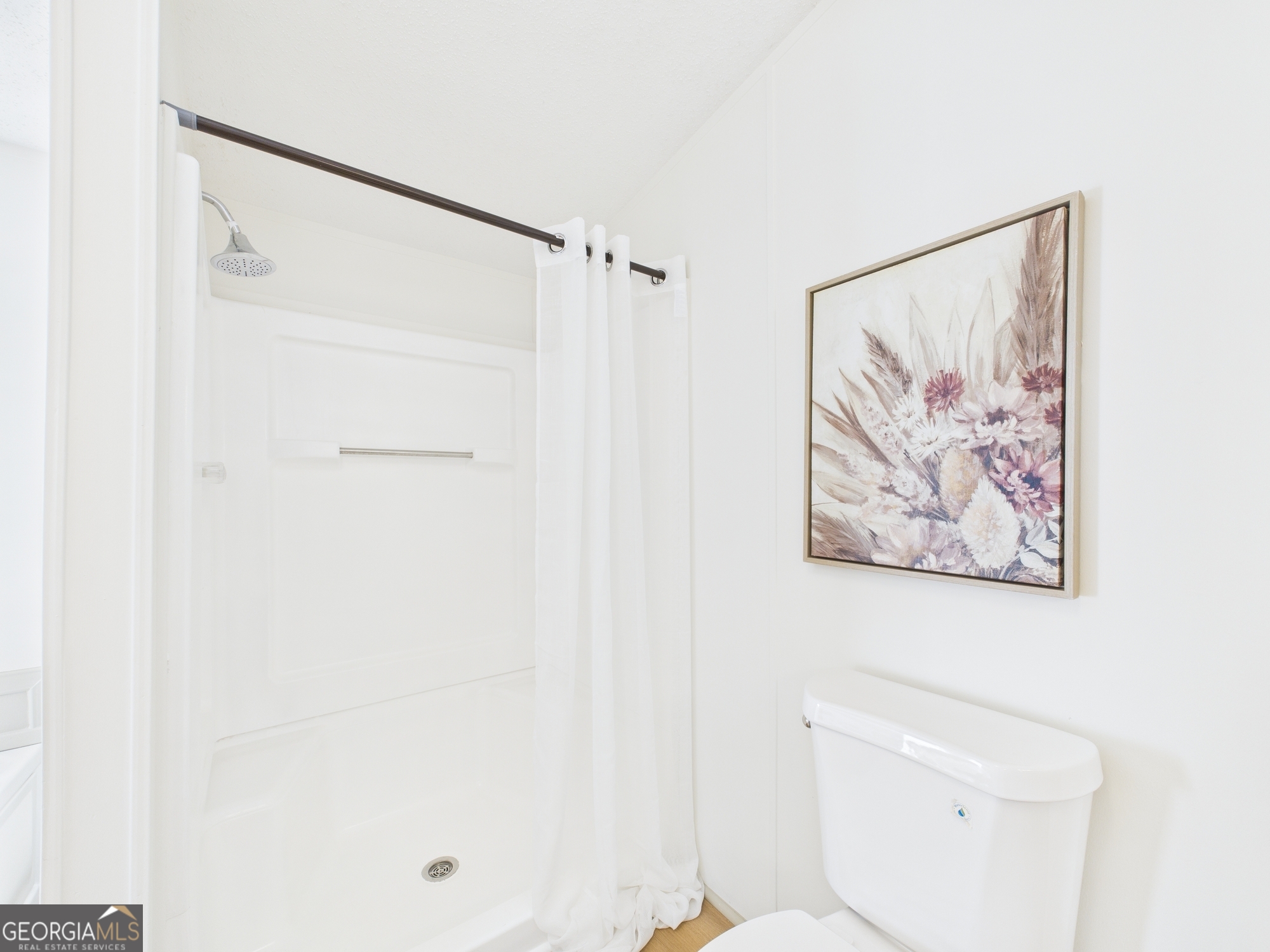 1669 Henderson Road Macon, GA 31217 - Photo 37 of 48 a bathroom with a shower and a toilet