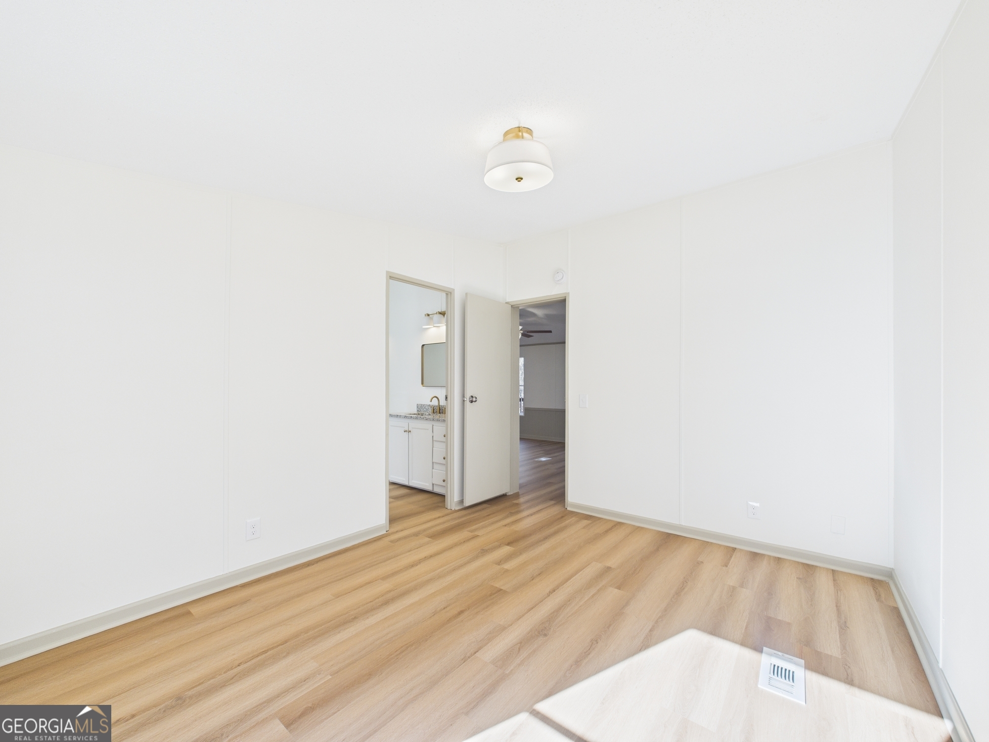1669 Henderson Road Macon, GA 31217 - Photo 39 of 48 a view of empty room with wooden floor