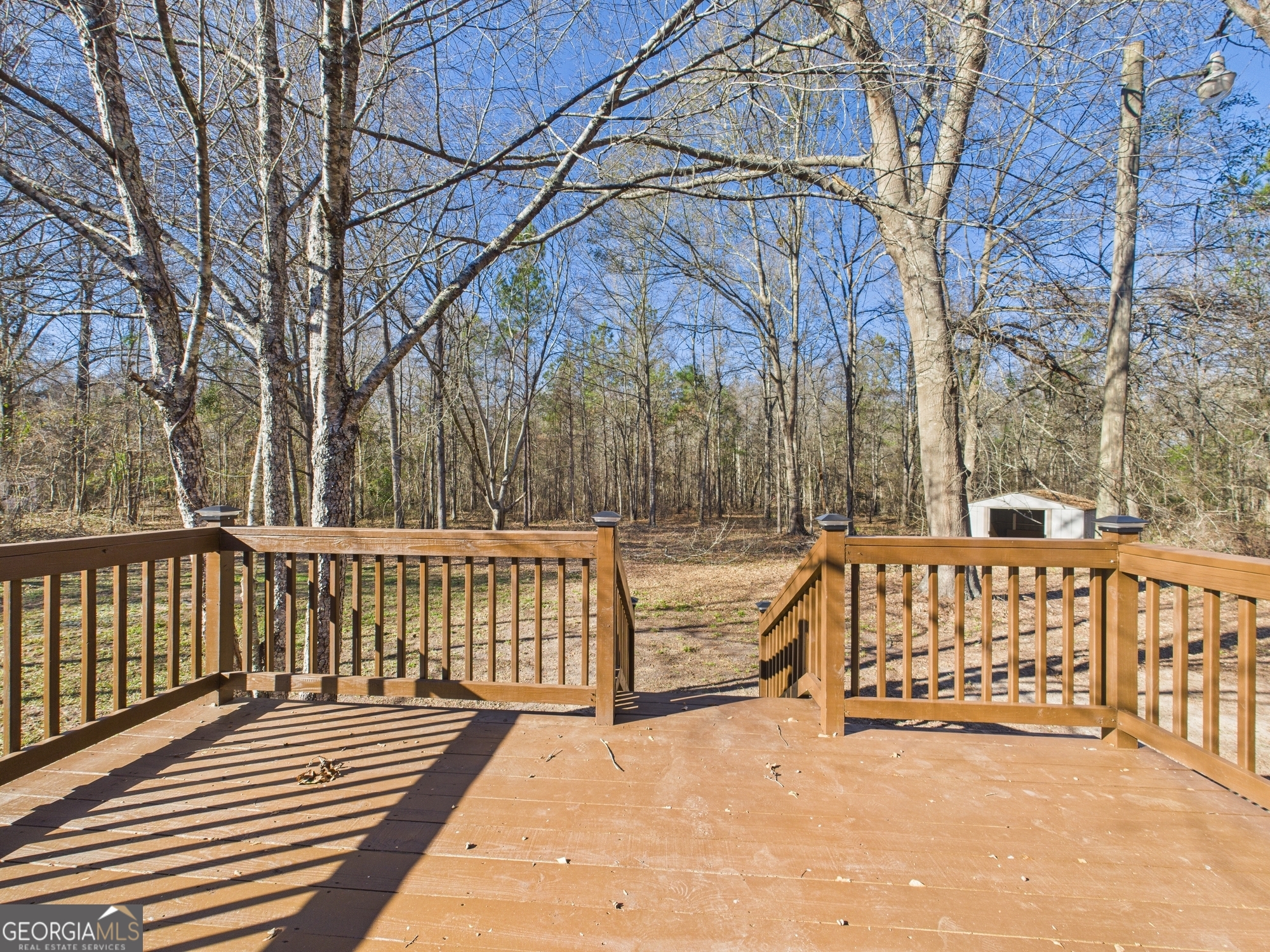 1669 Henderson Road Macon, GA 31217 - Photo 40 of 48 a view of backyard with large trees and wooden fence