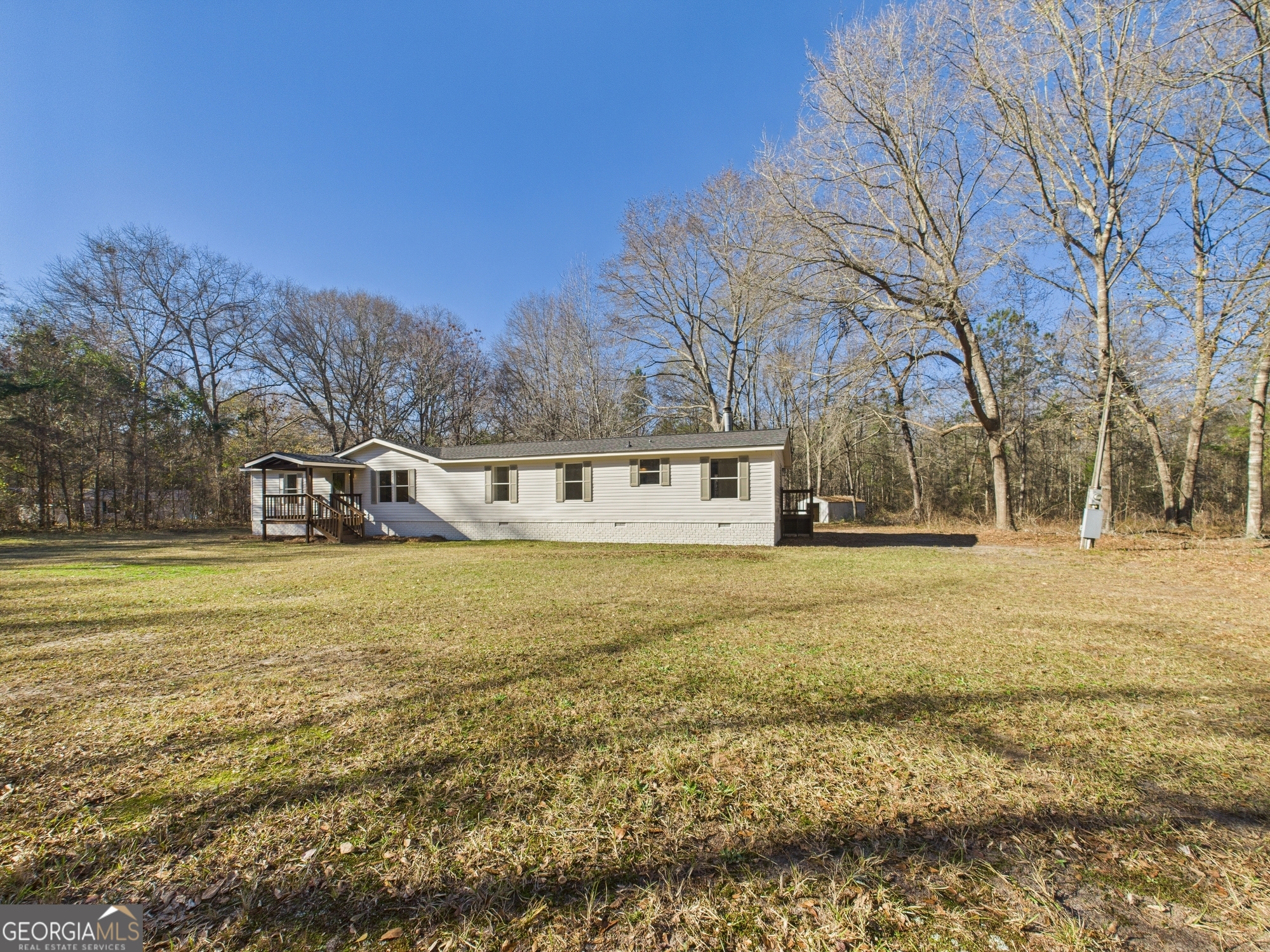 1669 Henderson Road Macon, GA 31217 - Photo 46 of 48 a view of a large house with a big yard