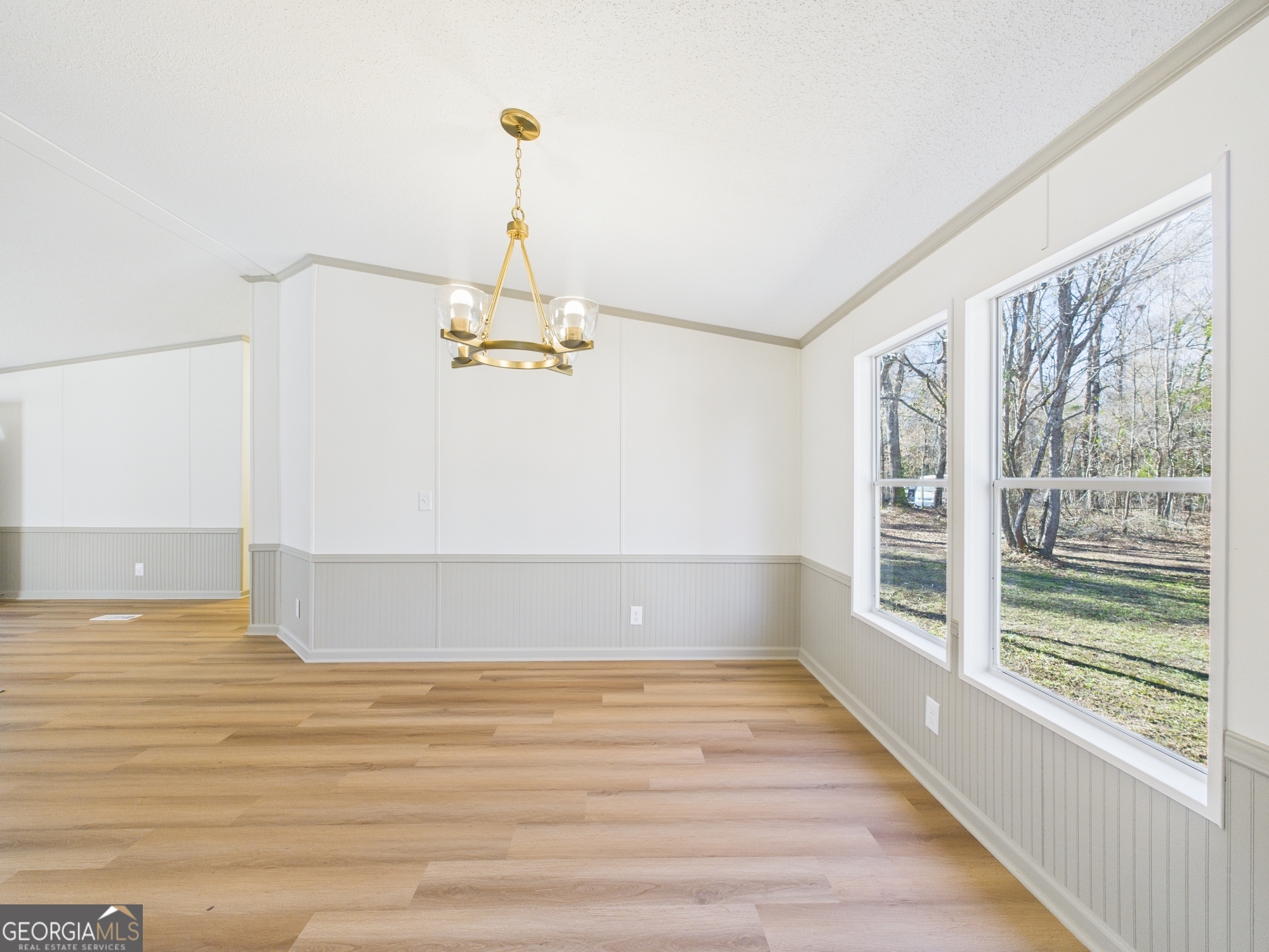 1669 Henderson Road Macon, GA 31217 - Photo 9 of 48 a view of a room with wooden floor and windows
