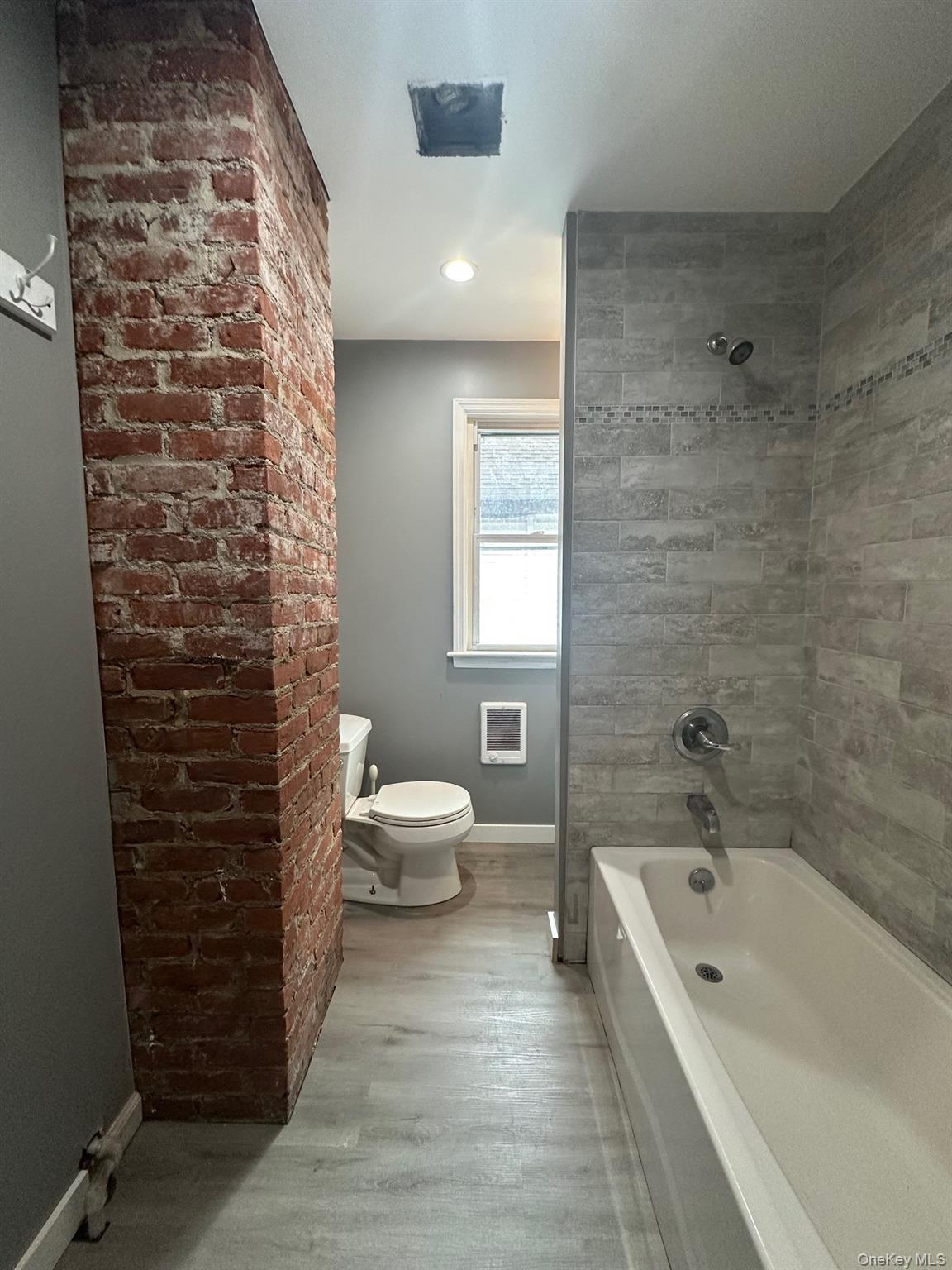197 North Hamilton Street, Unit 2 Poughkeepsie, NY 12601 - Photo 6 of 12 Full bathroom nicely renovated with beautiful tile wall in tub area.