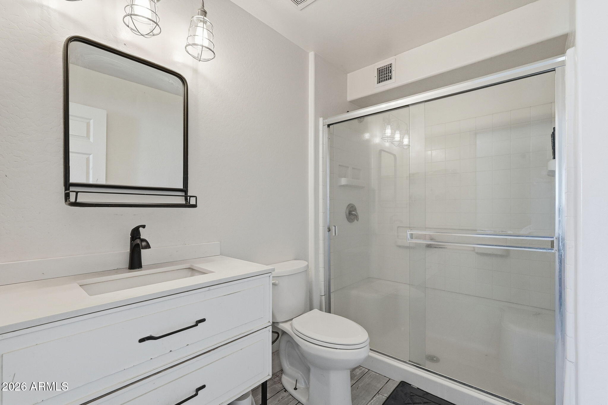 2858 East Redfield Road Gilbert, AZ 85234 - Photo 38 of 60 a bathroom with a toilet sink and shower