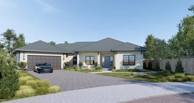 a front view of a house with a yard and a garage