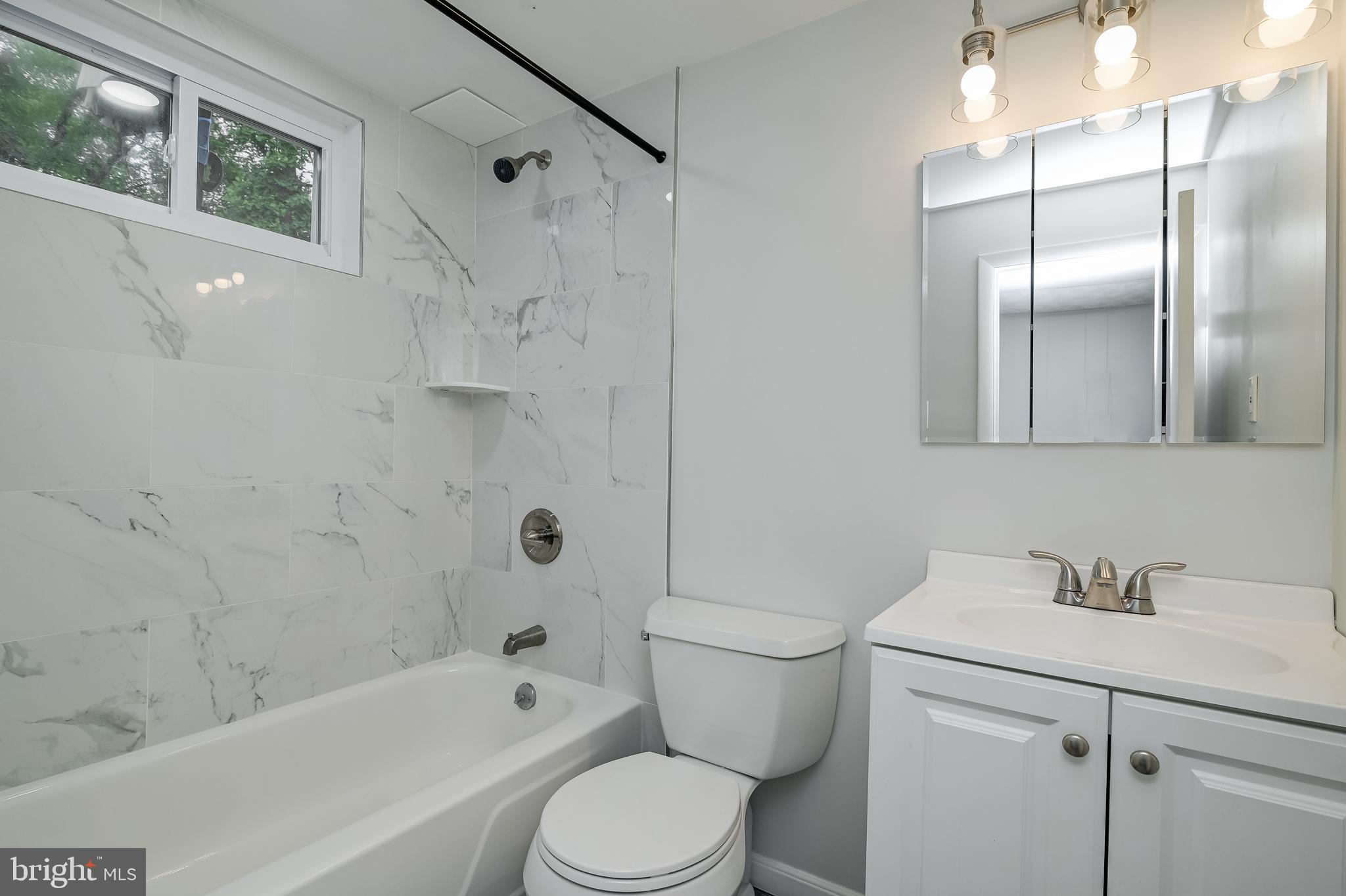 3808 Greenly Street Silver Spring, MD 20906 - Photo 11 of 52 Renovated basement level full bathroom, 2024