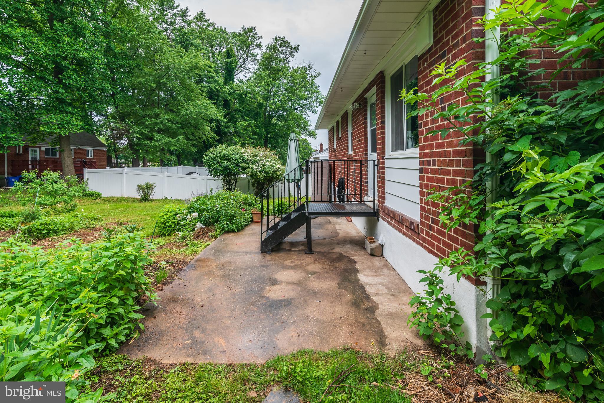3808 Greenly Street Silver Spring, MD 20906 - Photo 46 of 52 Rear with concrete patio and metal stairs