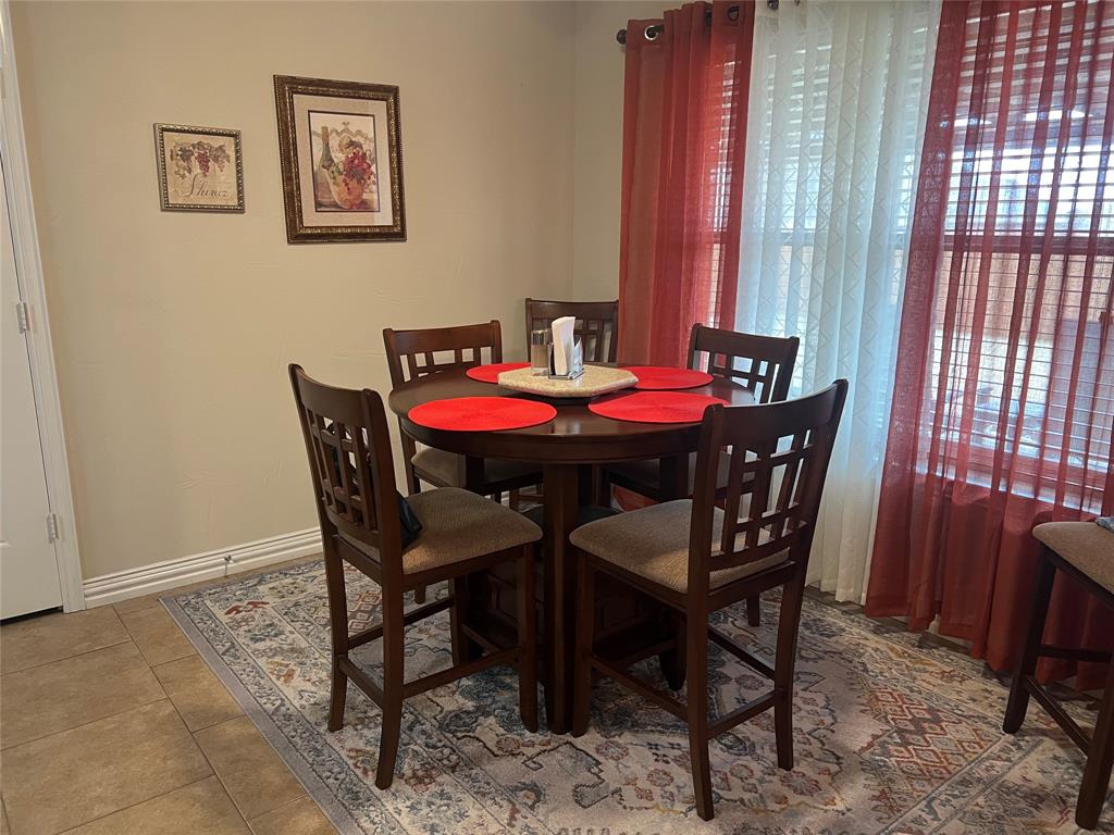 312 McAfee Street Mabank, TX 75147 - Photo 29 of 40 a dining room with furniture and window