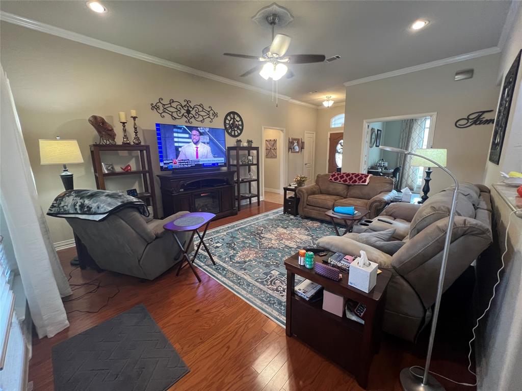312 McAfee Street Mabank, TX 75147 - Photo 6 of 40 a living room with furniture and a flat screen tv