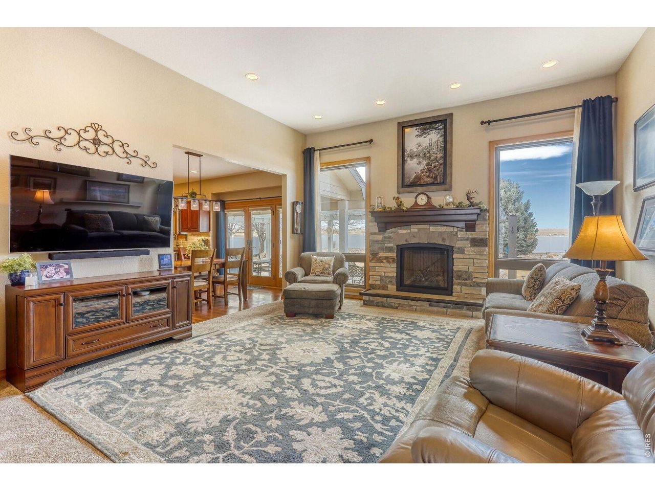 640 Valley View Road Loveland, CO 80537 - Photo 12 of 40 a living room with furniture and a flat screen tv