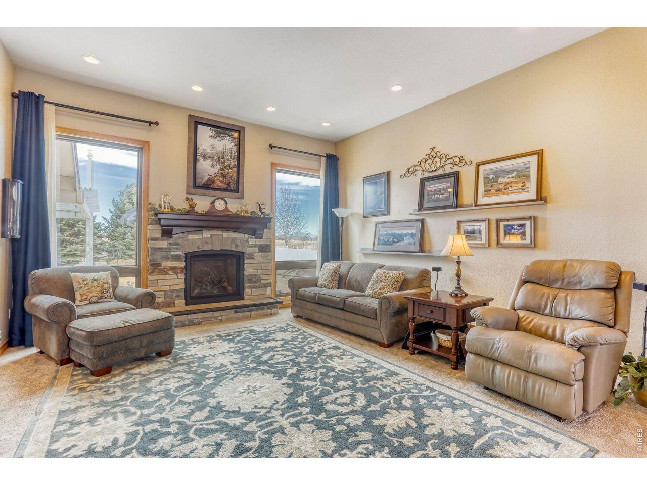 640 Valley View Road Loveland, CO 80537 - Photo 13 of 40 a living room with furniture and a fireplace