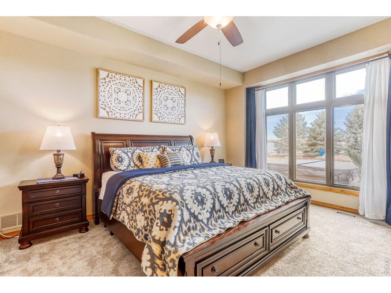 640 Valley View Road Loveland, CO 80537 - Photo 14 of 40 a bed sitting in a bedroom next to a window