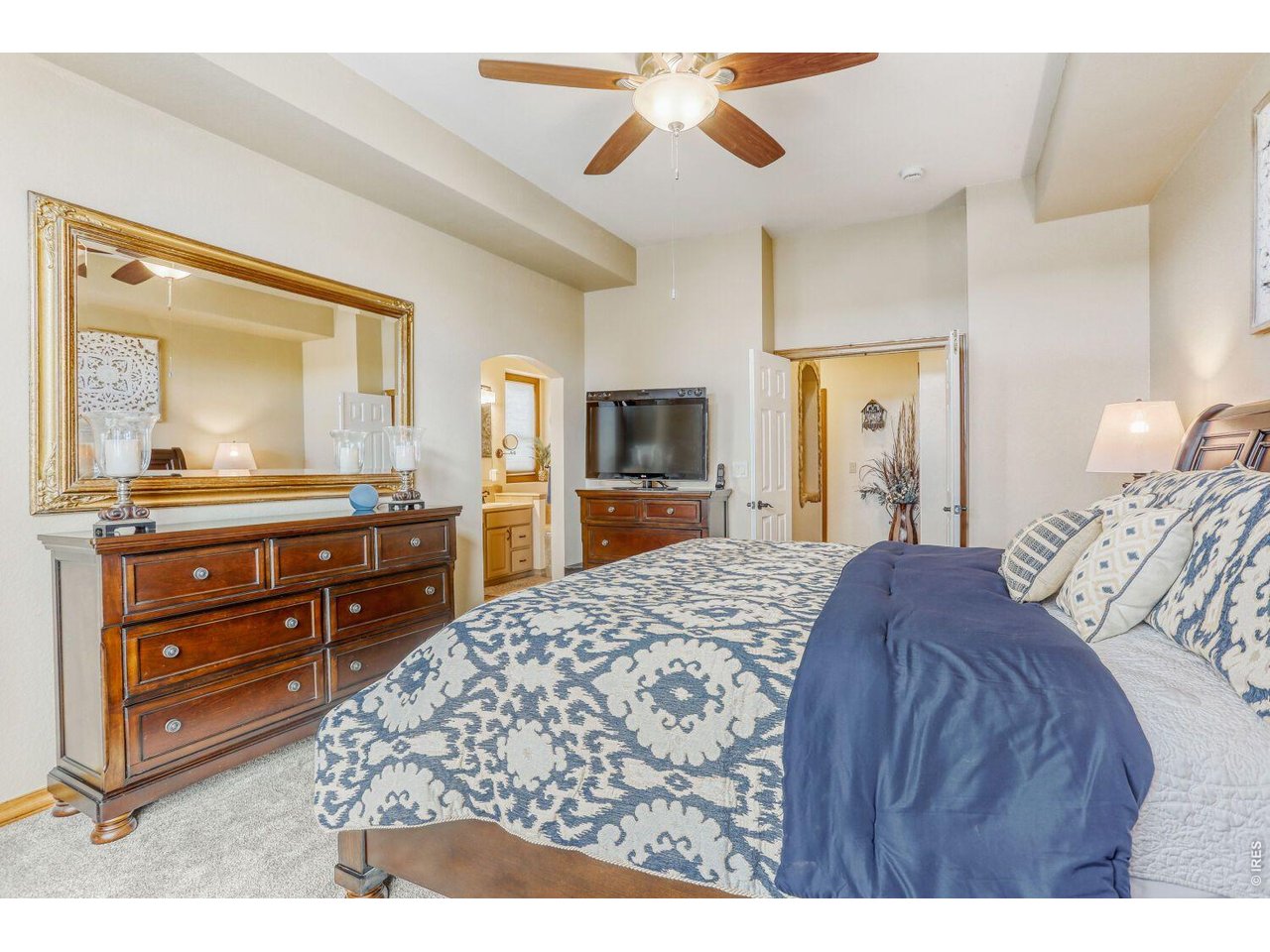 640 Valley View Road Loveland, CO 80537 - Photo 15 of 40 a bedroom with a bed and a dresser in it