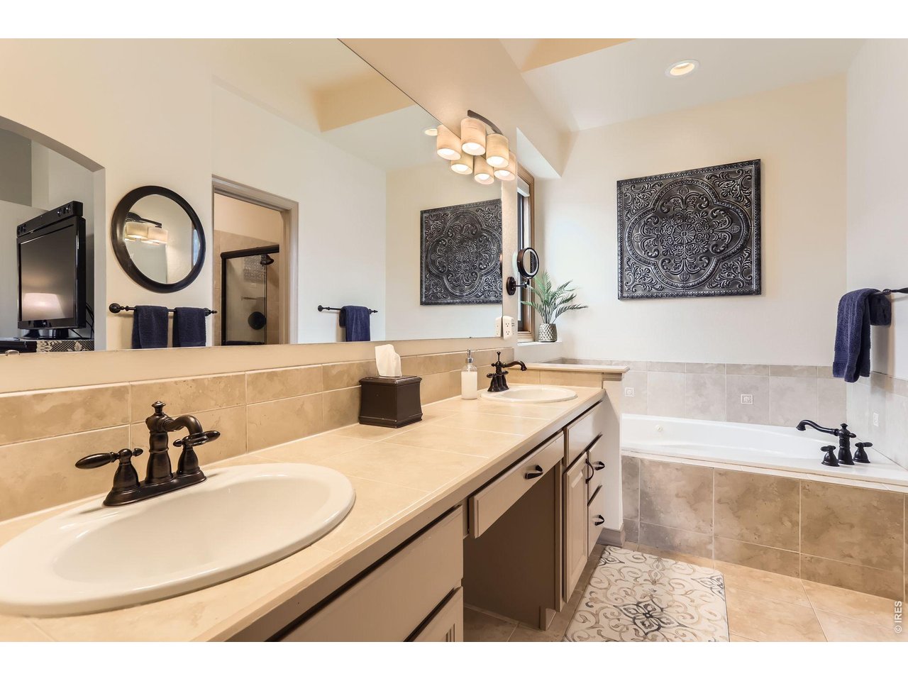 640 Valley View Road Loveland, CO 80537 - Photo 16 of 40 a bathroom with a sink and a mirror