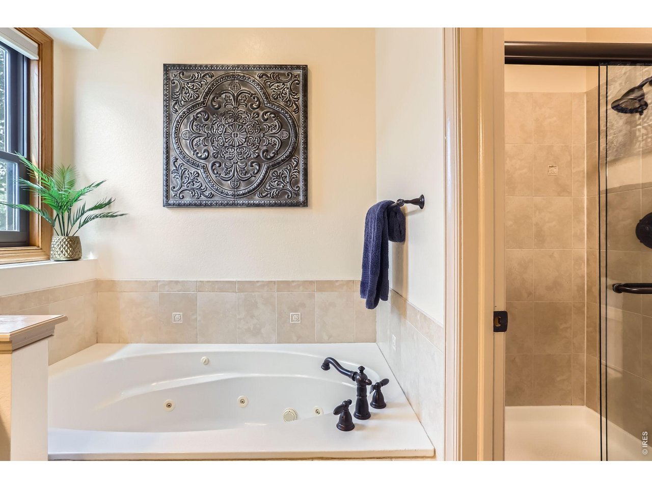 640 Valley View Road Loveland, CO 80537 - Photo 17 of 40 a bathroom with a bathtub and a shower