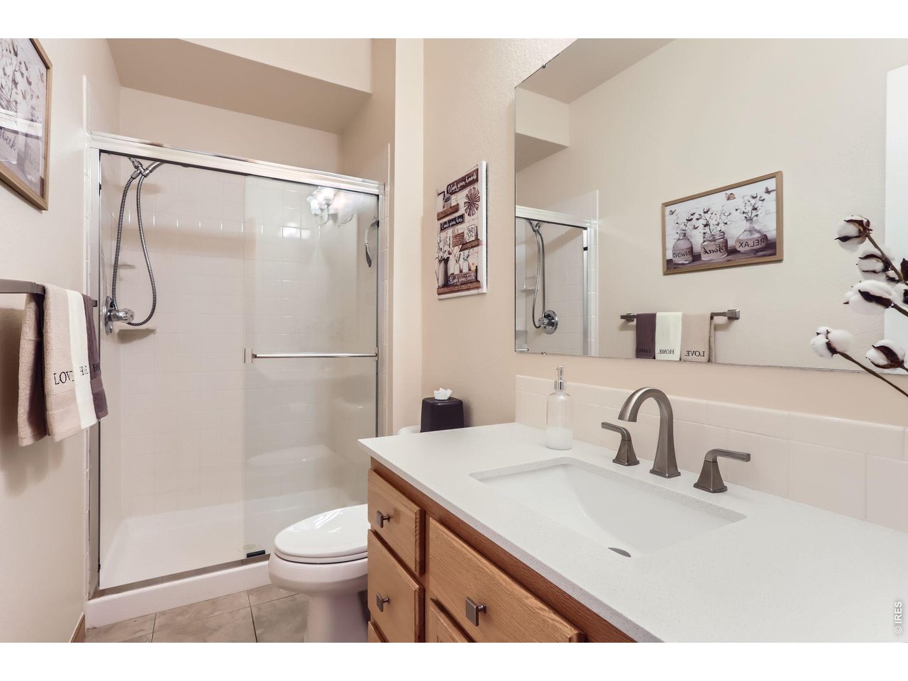 640 Valley View Road Loveland, CO 80537 - Photo 19 of 40 a bathroom with a sink toilet and shower