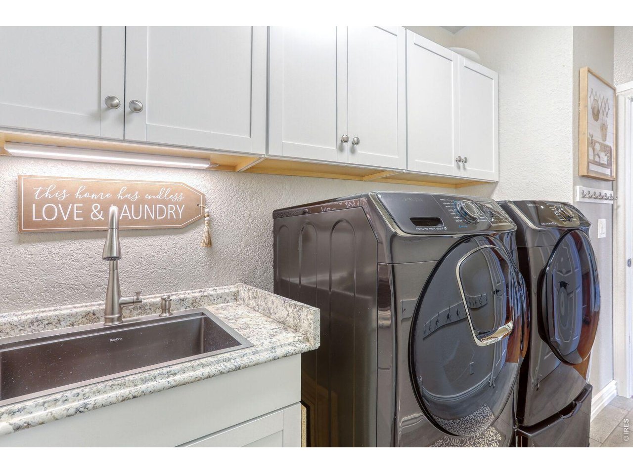 640 Valley View Road Loveland, CO 80537 - Photo 22 of 40 a utility room with sink dryer and washer