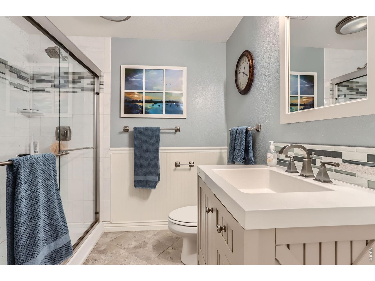 640 Valley View Road Loveland, CO 80537 - Photo 27 of 40 a bathroom with a sink a toilet a mirror and shower