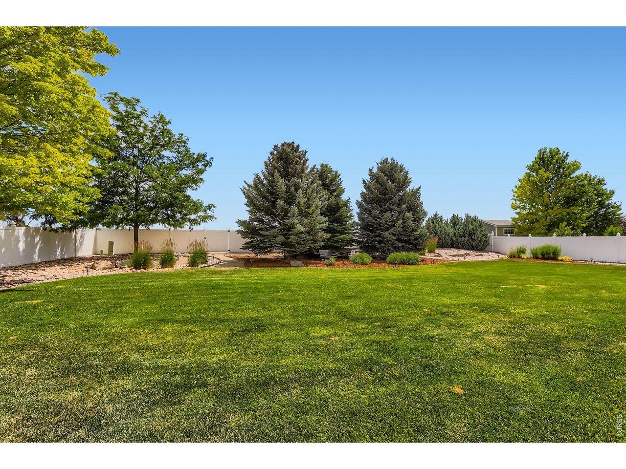 640 Valley View Road Loveland, CO 80537 - Photo 34 of 40 a view of a field of grass and trees