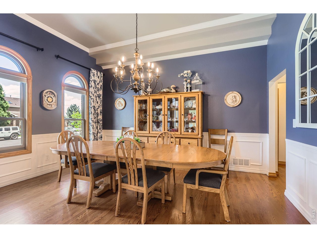 640 Valley View Road Loveland, CO 80537 - Photo 5 of 40 a view of a dining room with furniture wooden floor and chandelier