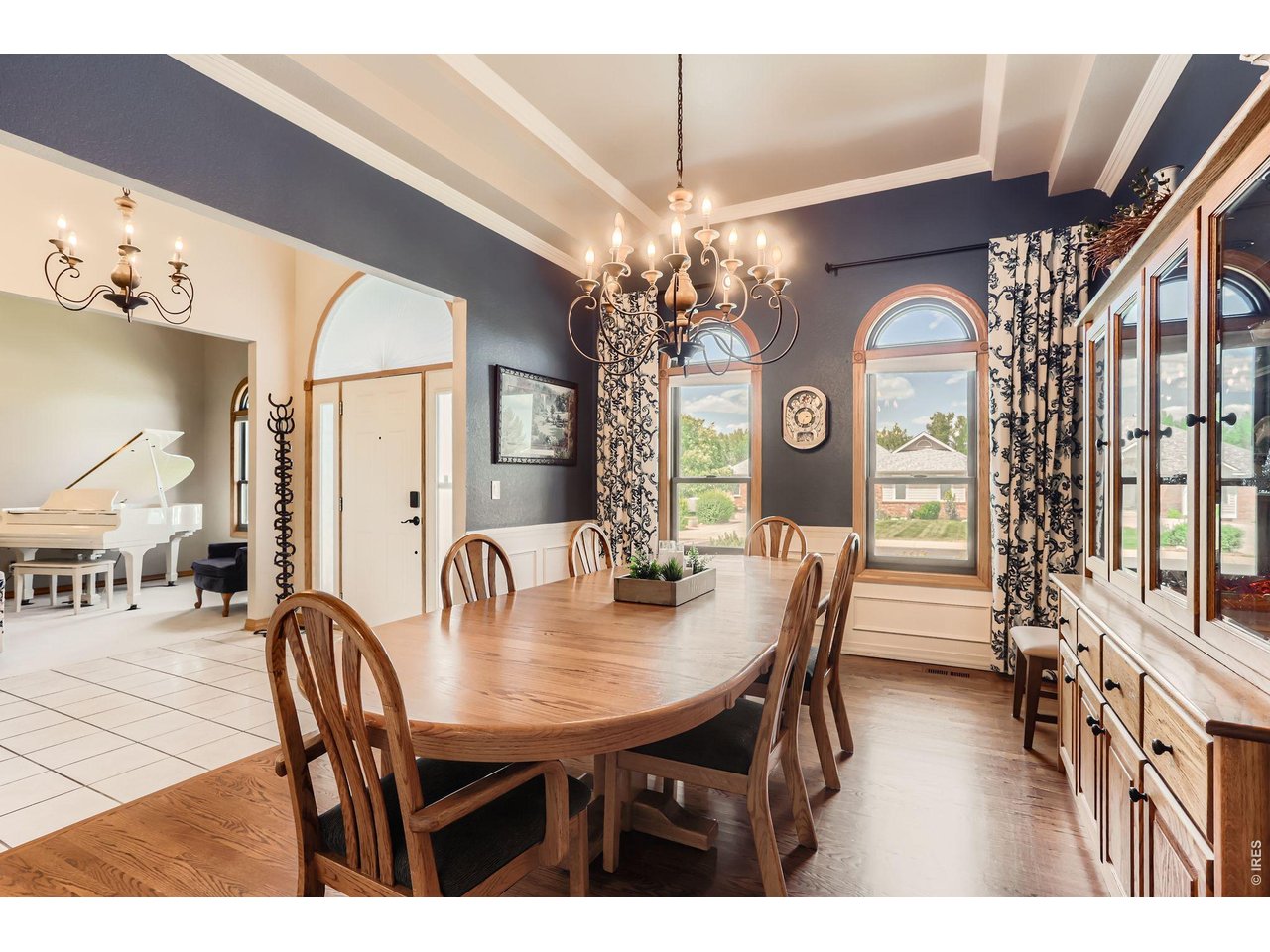 640 Valley View Road Loveland, CO 80537 - Photo 6 of 40 a dining room with furniture a chandelier and wooden floor