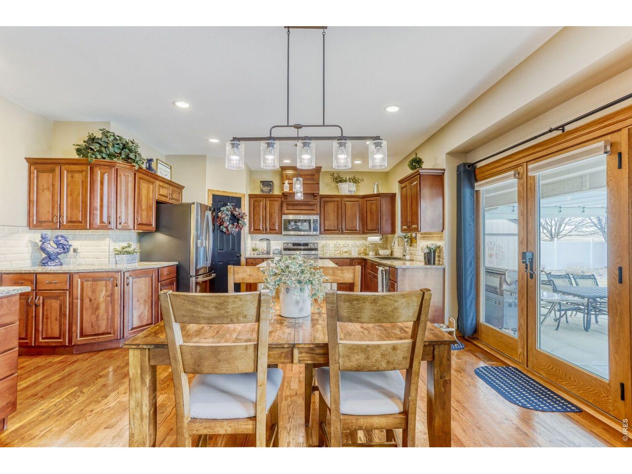 640 Valley View Road Loveland, CO 80537 - Photo 7 of 40 a dining room with granite countertop a table and chairs