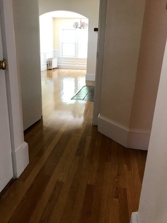 28 Beaconsfield Road, Unit 1 Brookline, MA 02445 - Photo 12 of 21 a view of empty room with wooden floor