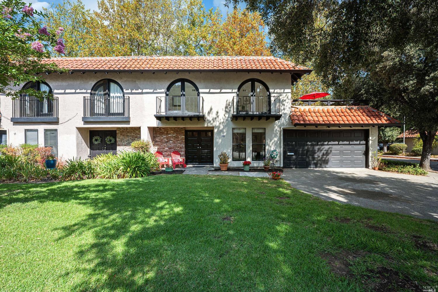 a front view of a house with garden