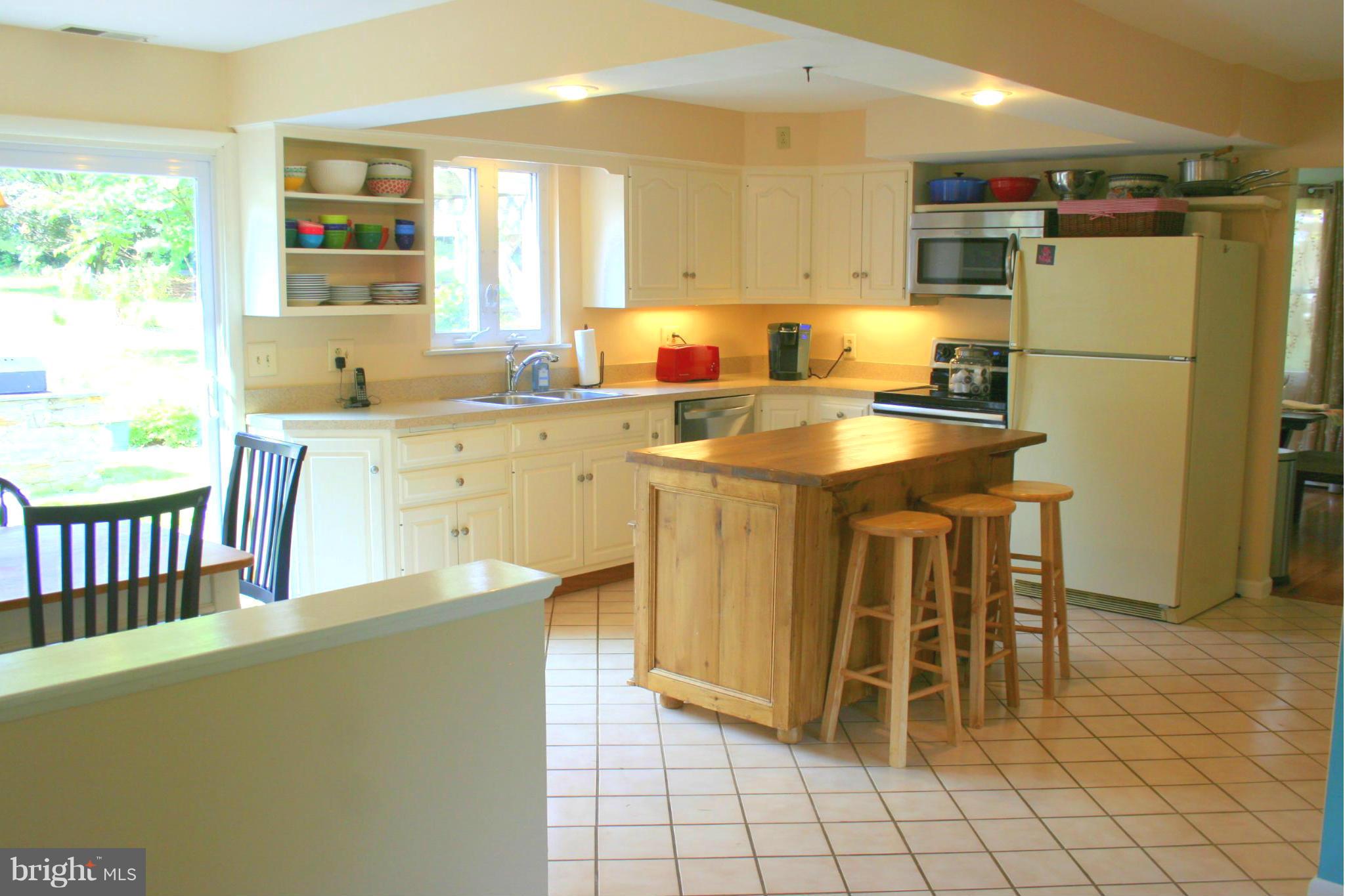 2901 Stockton Road Phoenix, MD 21131 - Photo 11 of 29 a kitchen with stainless steel appliances granite countertop a stove a sink a refrigerator and a refrigerator