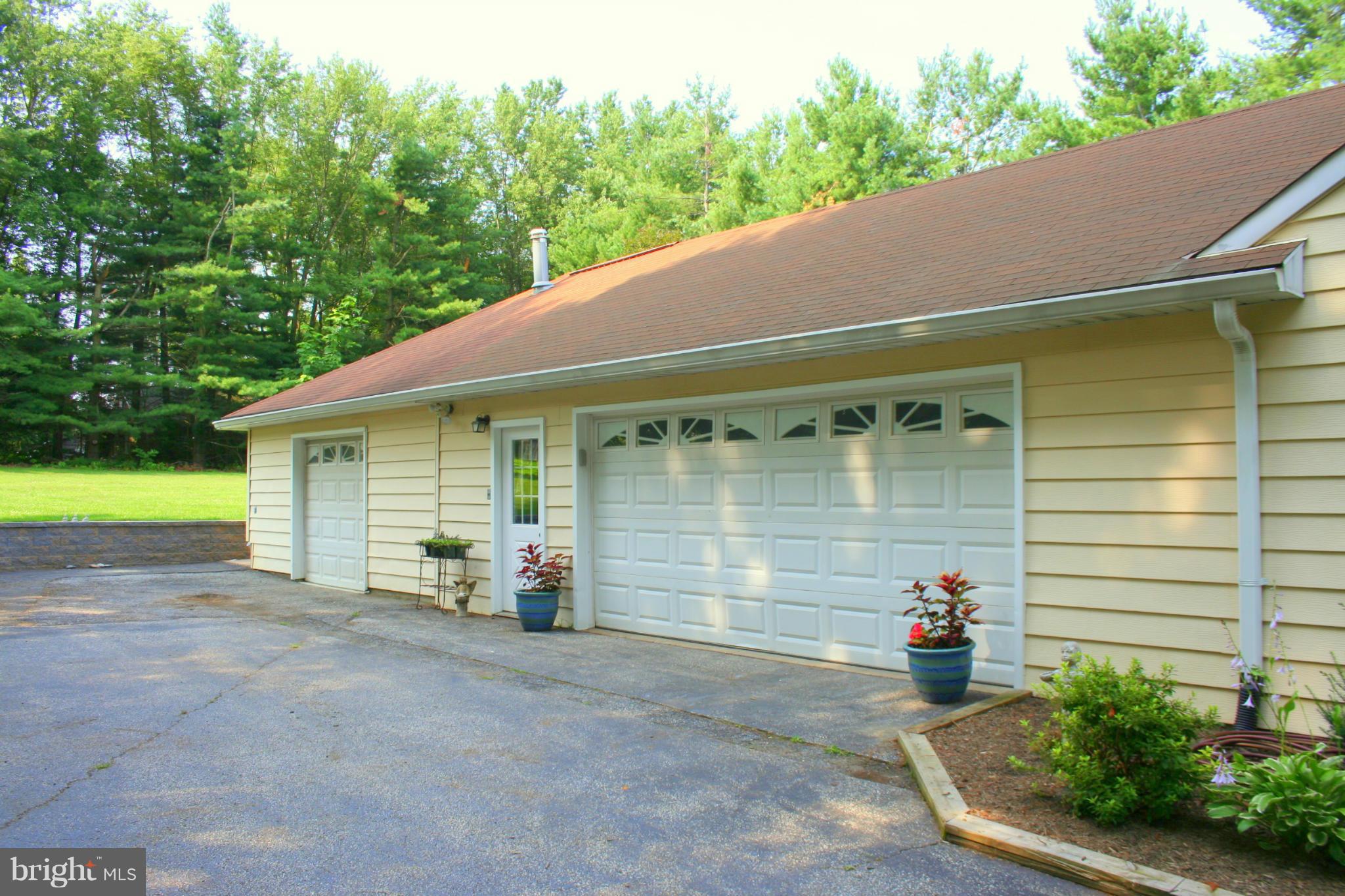 2901 Stockton Road Phoenix, MD 21131 - Photo 28 of 29 a view of a house with a yard and a garage