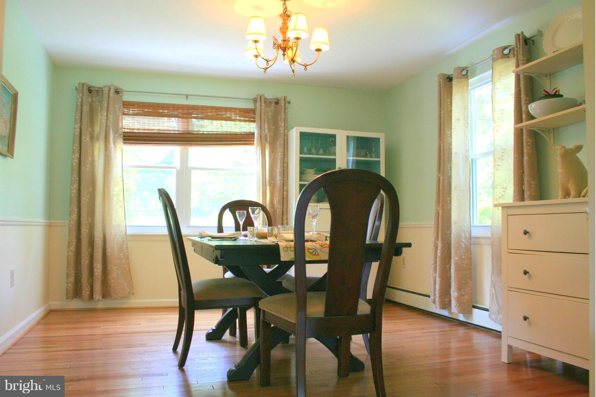 2901 Stockton Road Phoenix, MD 21131 - Photo 10 of 29 a view of a dining room with furniture and wooden floor