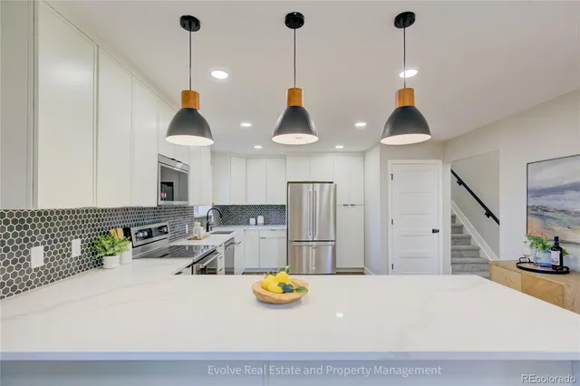 a view of a living room and kitchen
