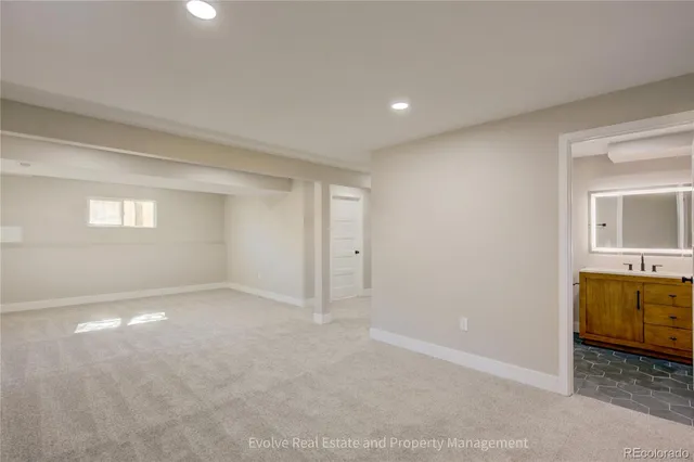 an empty room with a empty space and windows