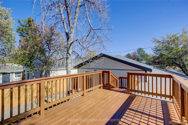 a house that has a tree in front of the house