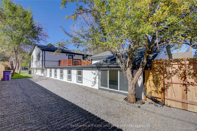 a house with a tree in front of it