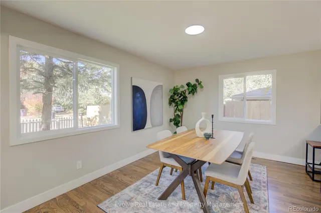 a view of a dining room with furniture window and wooden floor