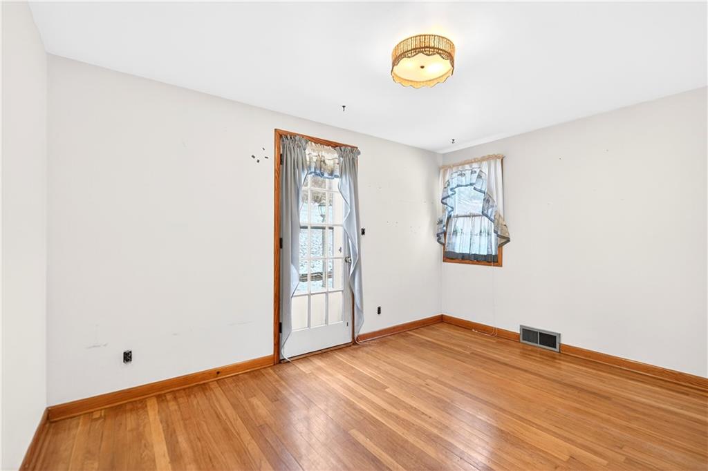 126 Bakers Lane Apollo, PA 15613 - Photo 16 of 28 an empty room with a window and ceiling fan