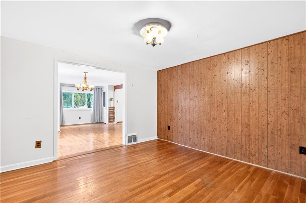 126 Bakers Lane Apollo, PA 15613 - Photo 10 of 28 a view of an empty room with wooden floor and a window
