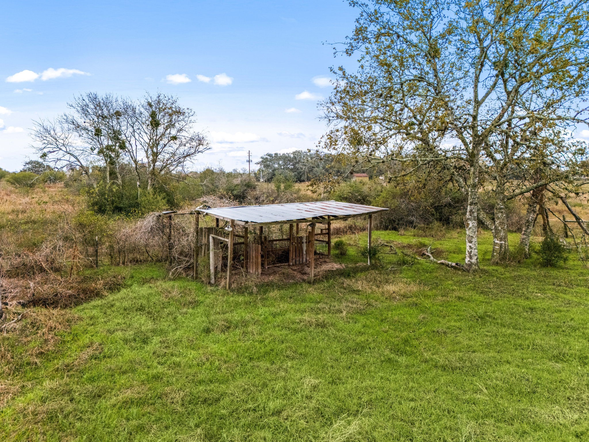 1187-1201 Ramsey Road Alleyton, TX 78935 - Photo 16 of 32 a view of a house with a yard porch and sitting area