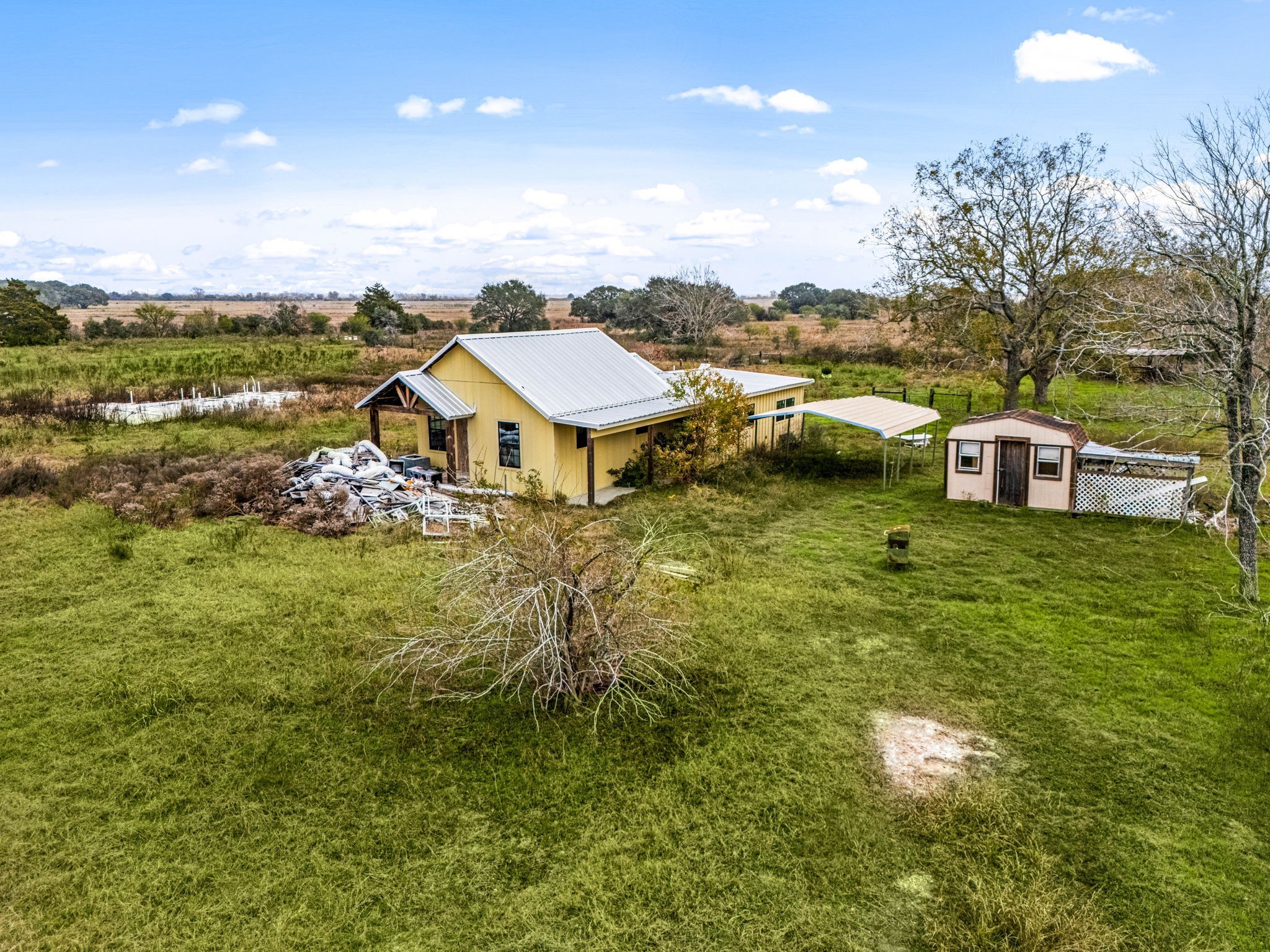1187-1201 Ramsey Road Alleyton, TX 78935 - Photo 19 of 32 a aerial view of a house with garden space and ocean view
