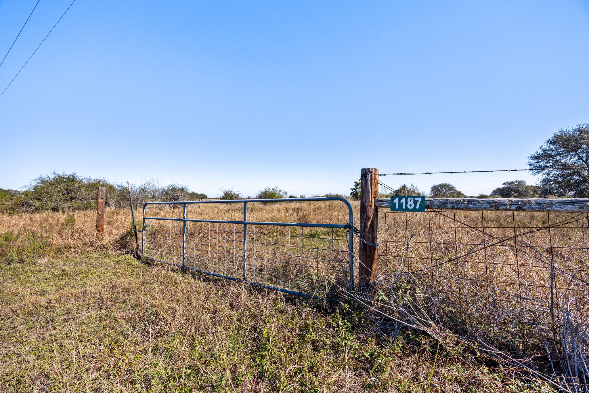 1187-1201 Ramsey Road Alleyton, TX 78935 - Photo 27 of 32 a view of a pathway with a wrought fence