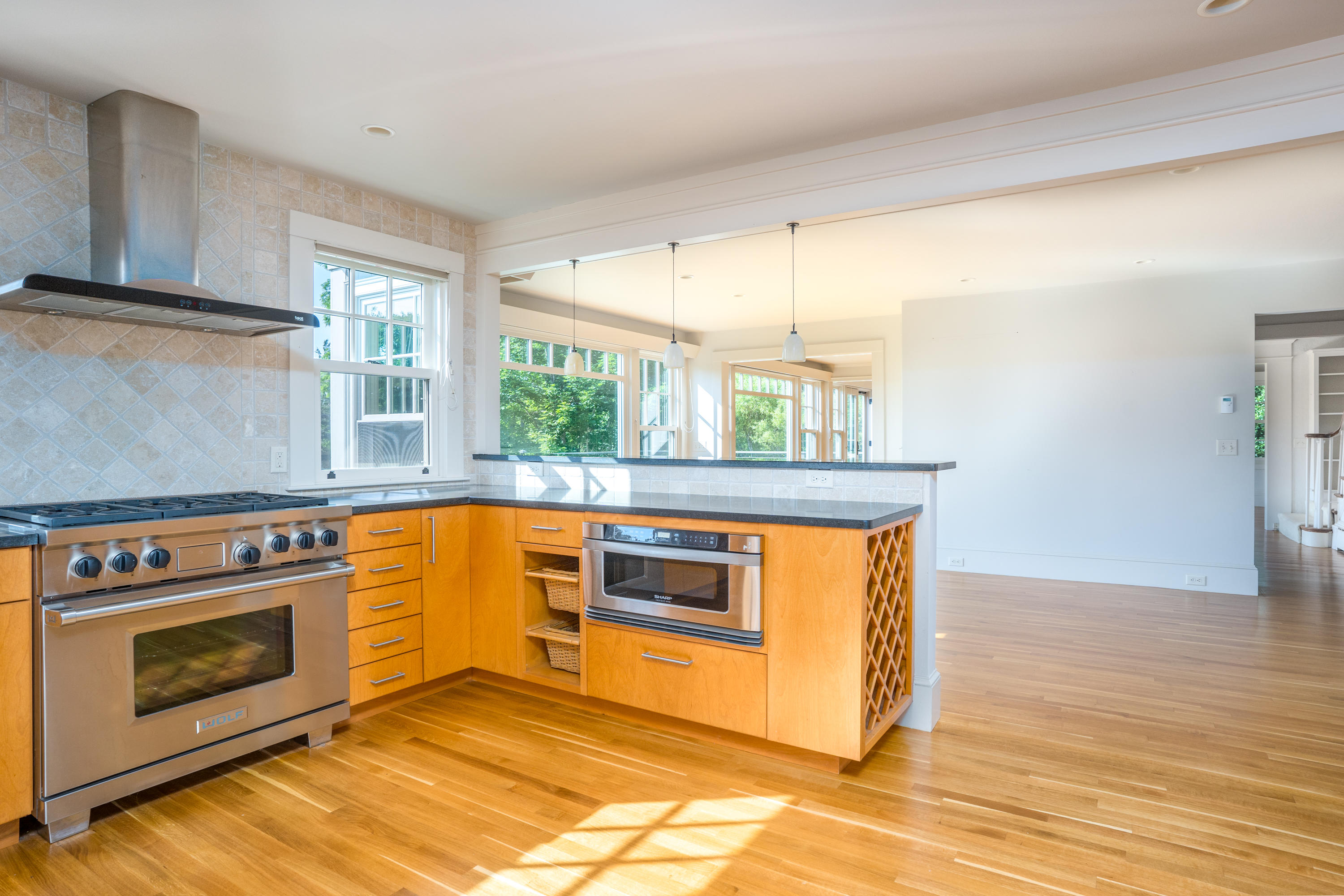 268 Elm Road Falmouth, MA 02540 - Photo 11 of 29 a kitchen with stainless steel appliances granite countertop a stove a sink and a microwave