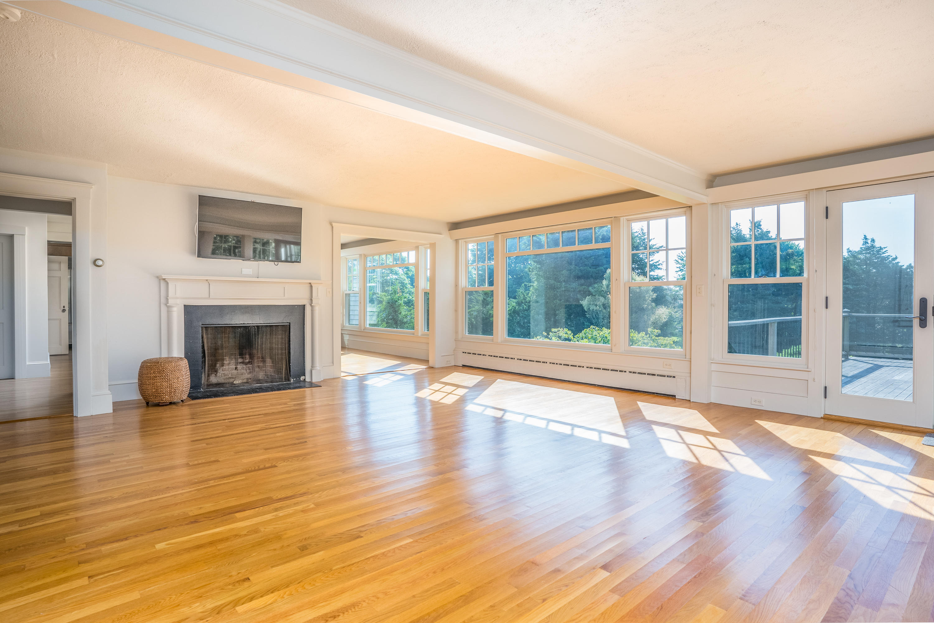268 Elm Road Falmouth, MA 02540 - Photo 6 of 29 a view of an empty room with wooden floor and a window