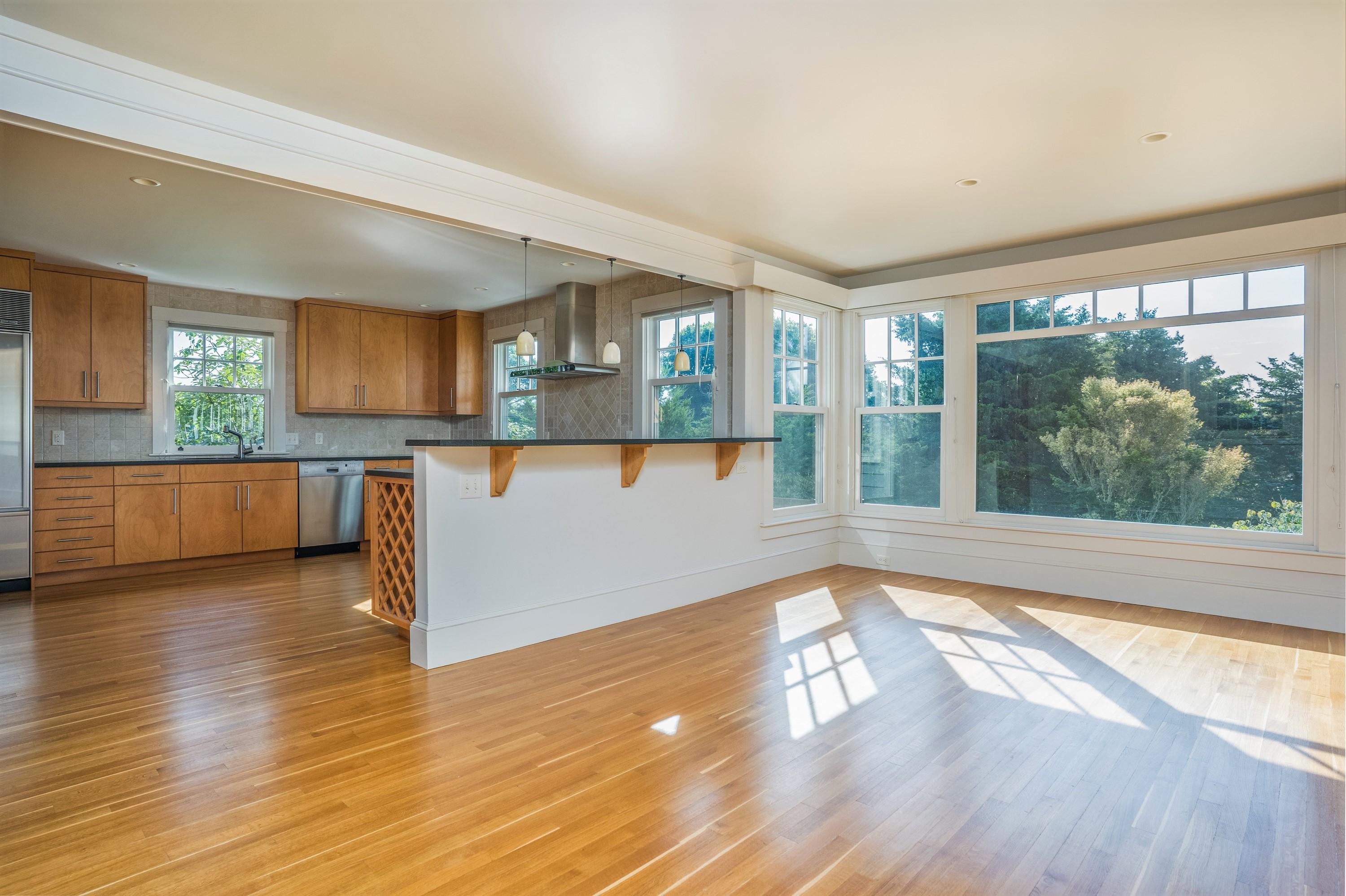 268 Elm Road Falmouth, MA 02540 - Photo 8 of 29 a view of a kitchen with wooden floor and a window
