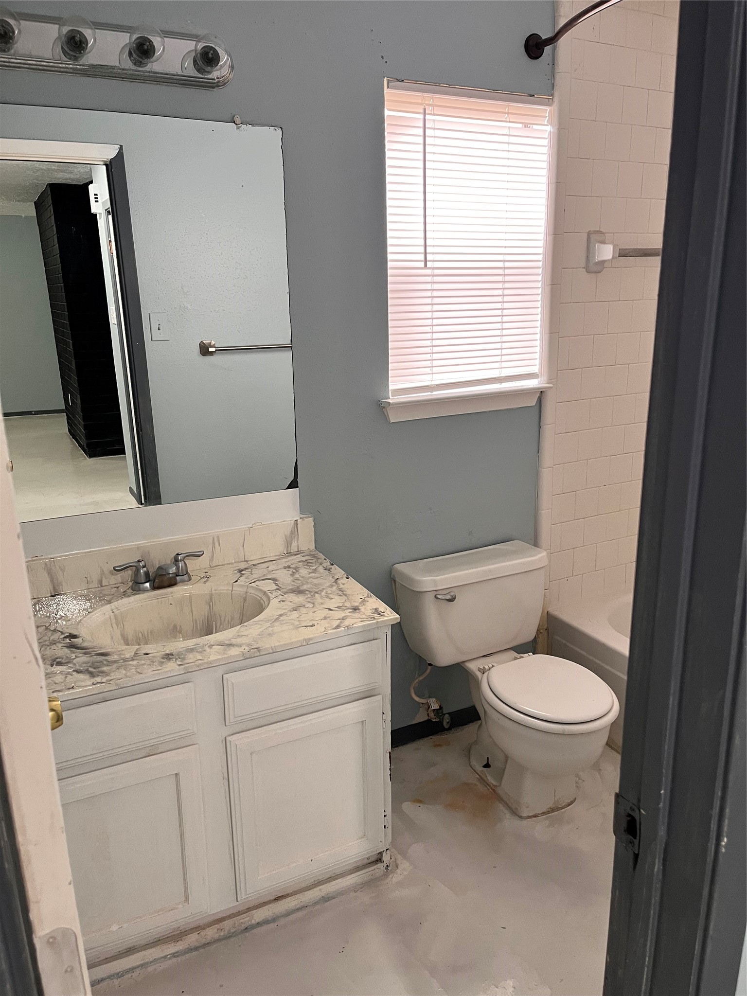 16631 Gold Ridge Lane Houston, TX 77053 - Photo 13 of 18 a bathroom with a toilet sink and mirror