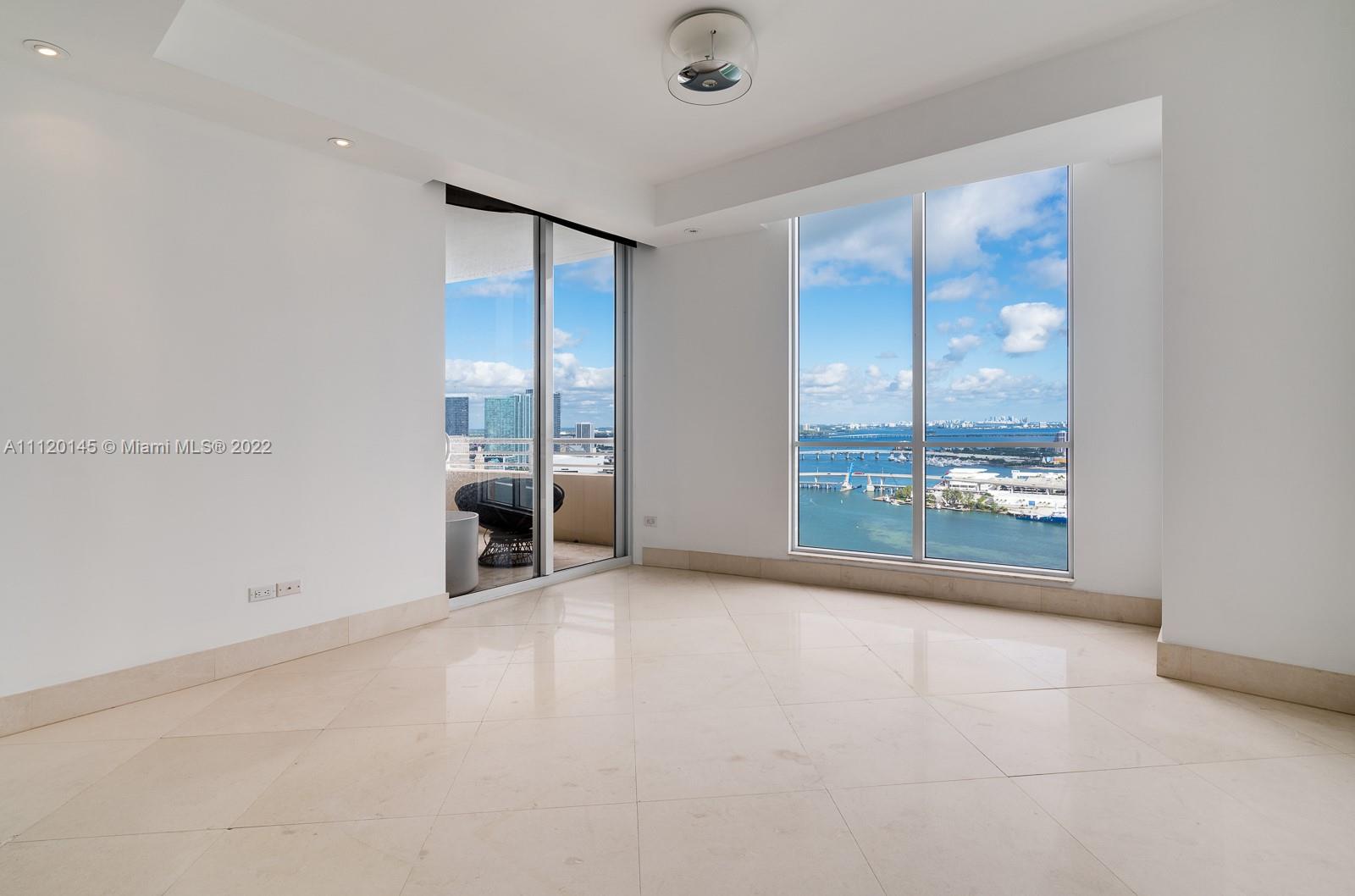 848 Brickell Key Drive, Unit 4002 Miami, FL 33131 - Photo 11 of 19 a view of an empty room with a window