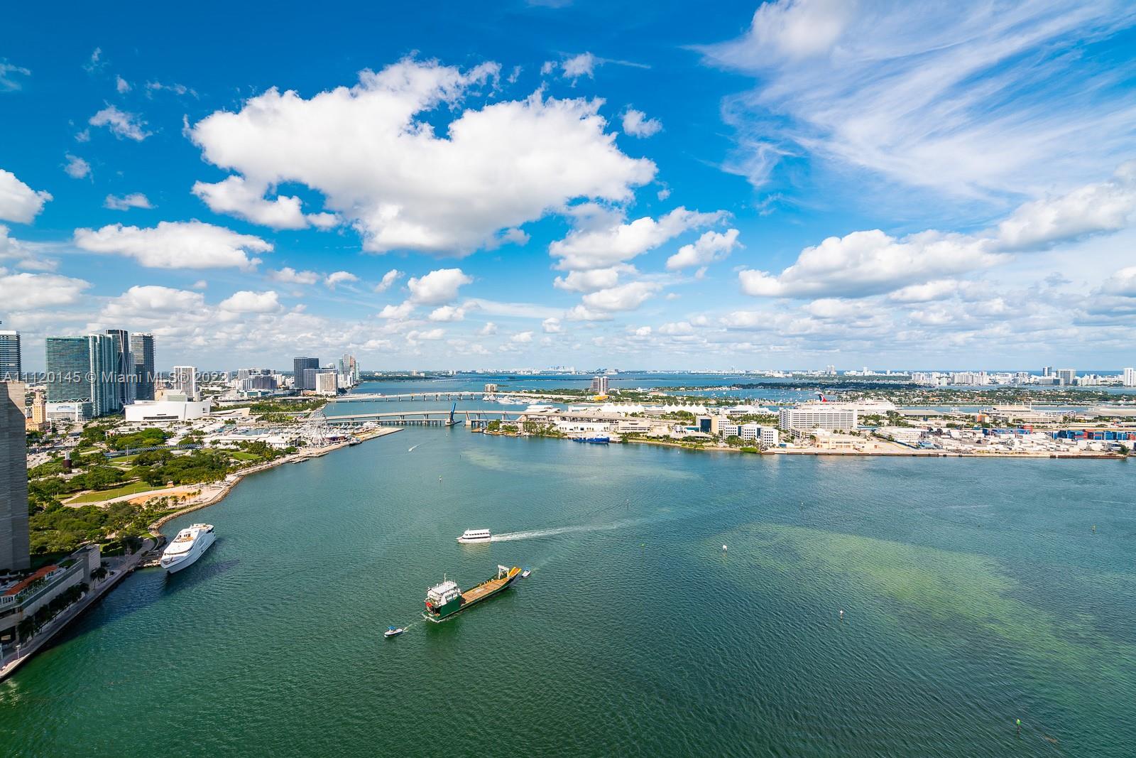 848 Brickell Key Drive, Unit 4002 Miami, FL 33131 - Photo 18 of 19 a view of a lake with a city