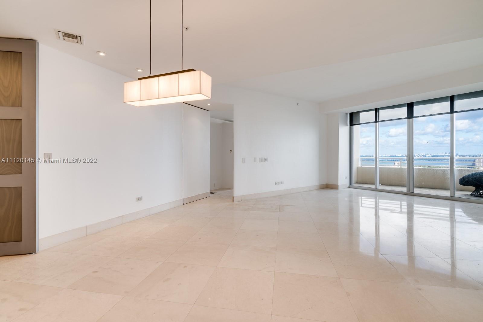 848 Brickell Key Drive, Unit 4002 Miami, FL 33131 - Photo 4 of 19 a view of an empty room with a window