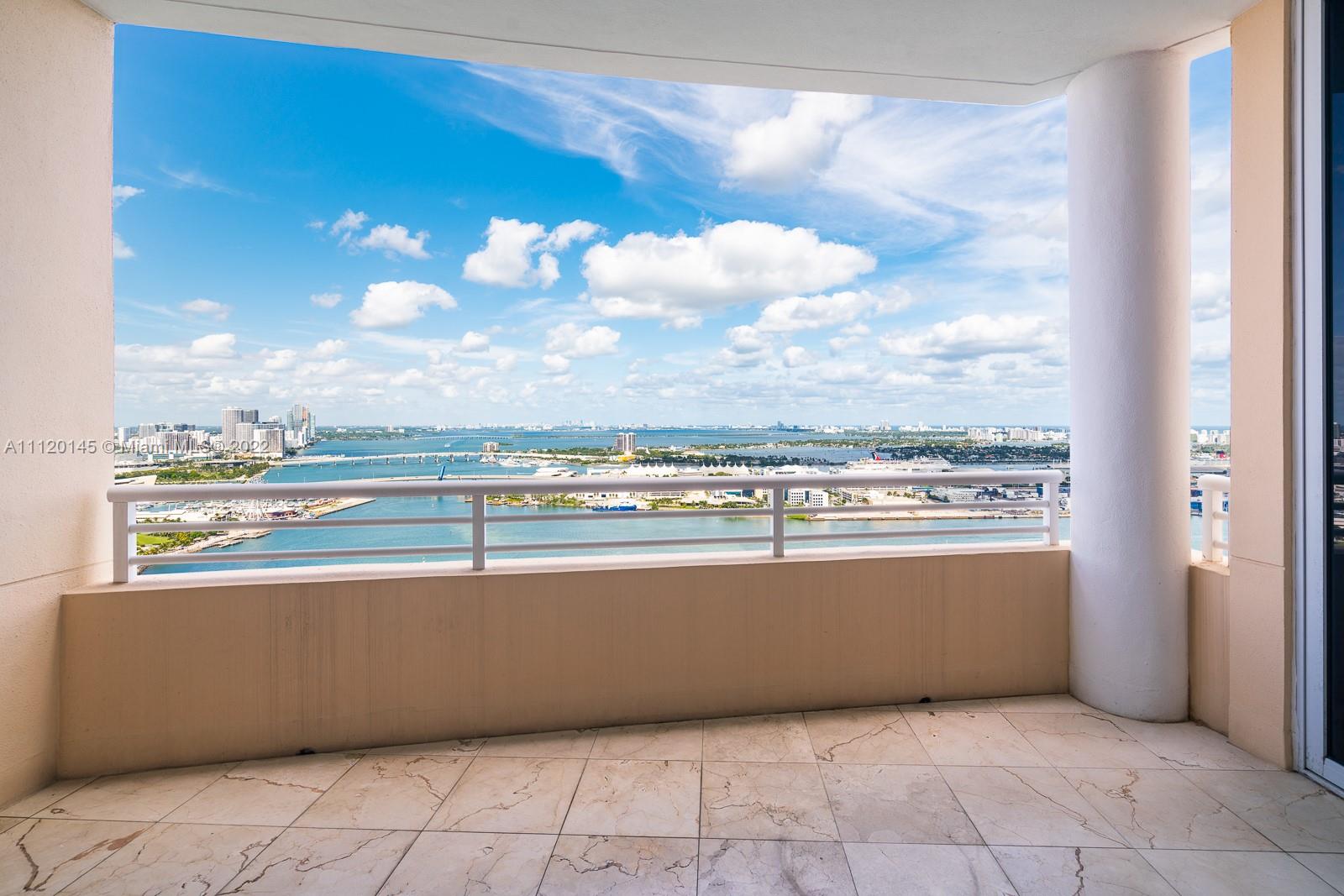 848 Brickell Key Drive, Unit 4002 Miami, FL 33131 - Photo 5 of 19 a view of a balcony with an outdoor seating